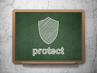 Image showing Safety concept: Shield and Protect on chalkboard background