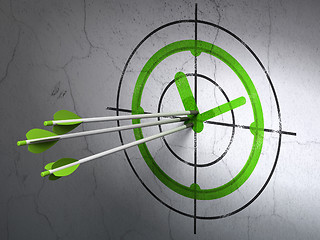 Image showing Time concept: arrows in Clock target on wall background