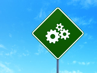 Image showing Marketing concept: Gears on road sign background