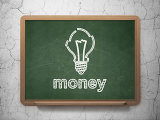 Image showing Business concept: Light Bulb and Money on chalkboard background