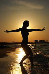 Image showing Sunset Tai-Chi on a beach