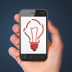 Image showing Finance concept: Light Bulb on smartphone