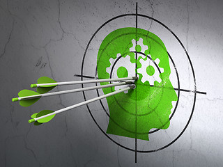 Image showing Business concept: arrows in Head With Gears target on wall