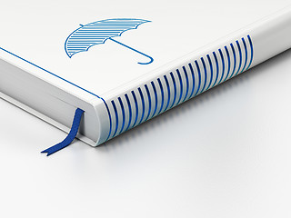 Image showing Protection concept: closed book, Umbrella on white background