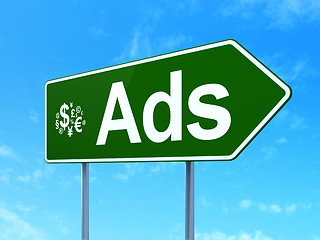 Image showing Advertising concept: Ads and Finance Symbol on road sign