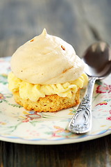 Image showing Plate with meringue and teaspoon.