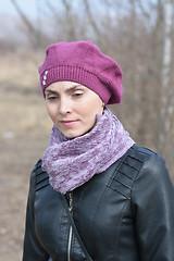 Image showing Woman in pink beret and black leather jacket on a walk