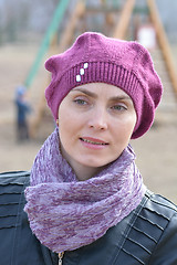 Image showing Woman in pink beret and black leather jacket on a walk