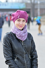 Image showing Woman in pink beret and black leather jacket on a walk