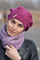 Image showing Woman in pink beret and black leather jacket on a walk