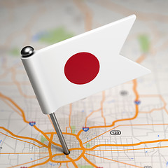 Image showing Japan Small Flag on a Map Background.