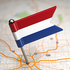 Image showing Netherlands Small Flag on a Map Background.