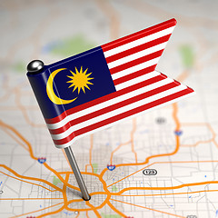 Image showing Malaysia Small Flag on a Map Background.