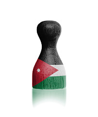 Image showing Wooden pawn with a flag painting