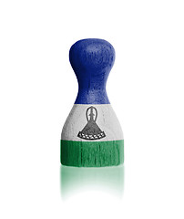 Image showing Wooden pawn with a flag painting