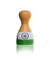 Image showing Wooden pawn with a flag painting