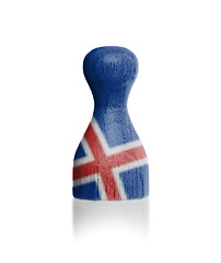 Image showing Wooden pawn with a flag painting