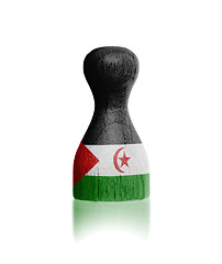 Image showing Wooden pawn with a flag painting