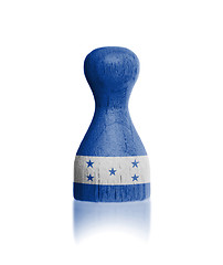 Image showing Wooden pawn with a flag painting