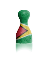 Image showing Wooden pawn with a flag painting