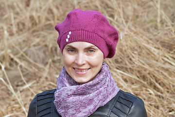 Image showing  Woman in pink beret and black leather jacket