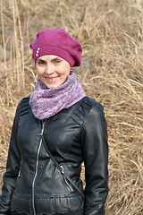 Image showing  Woman in pink beret and black leather jacket