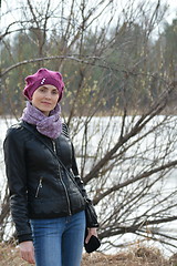 Image showing Woman in pink beret and black leather jacket