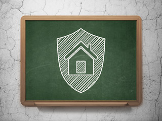 Image showing Privacy concept: Shield on chalkboard background