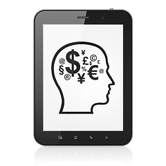 Image showing Advertising concept: Head With Finance Symbol on tablet