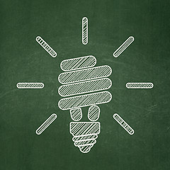 Image showing Business concept: Energy Saving Lamp on chalkboard background