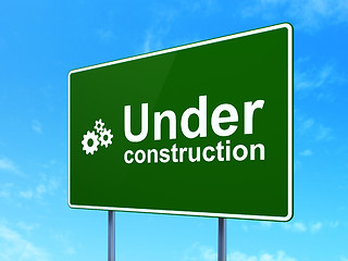 Image showing Web design concept: Under Construction and Gears on road sign