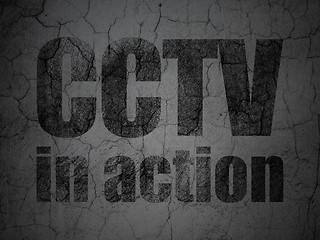 Image showing Safety concept: CCTV In action on grunge wall background