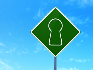 Image showing Security concept: Keyhole on road sign background