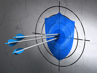 Image showing Privacy concept: arrows in Shield target on wall background