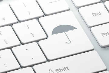 Image showing Security concept: Umbrella on computer keyboard background