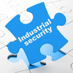 Image showing Protection concept: Industrial Security on puzzle background