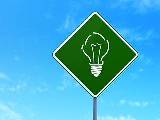 Image showing Finance concept: Light Bulb on road sign background