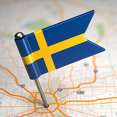 Image showing Sweden Small Flag on a Map Background.