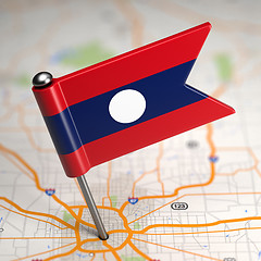 Image showing Laos Small Flag on a Map Background.