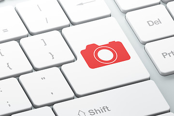 Image showing Vacation concept: Photo Camera on computer keyboard background