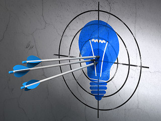 Image showing Finance concept: arrows in Light Bulb target on wall background