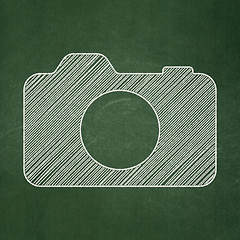 Image showing Travel concept: Photo Camera on chalkboard background