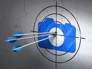 Image showing Travel concept: arrows in Photo Camera target on wall background