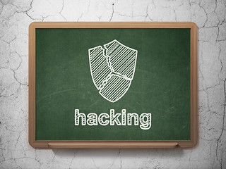 Image showing Security concept: Broken Shield and Hacking on chalkboard