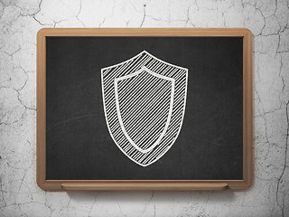 Image showing Security concept: Shield on chalkboard background