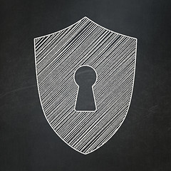 Image showing Protection concept: Shield With Keyhole on chalkboard background