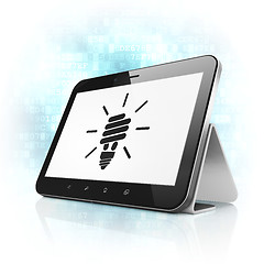 Image showing Finance concept: Energy Saving Lamp on tablet pc computer