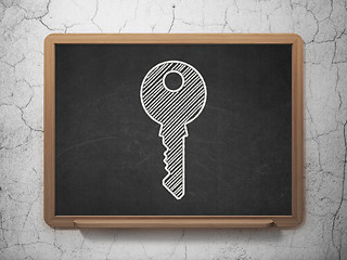 Image showing Safety concept: Key on chalkboard background