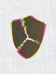 Image showing Safety concept: Broken Shield on fabric texture background