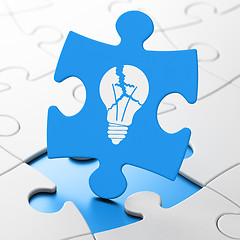 Image showing Business concept: Light Bulb on puzzle background